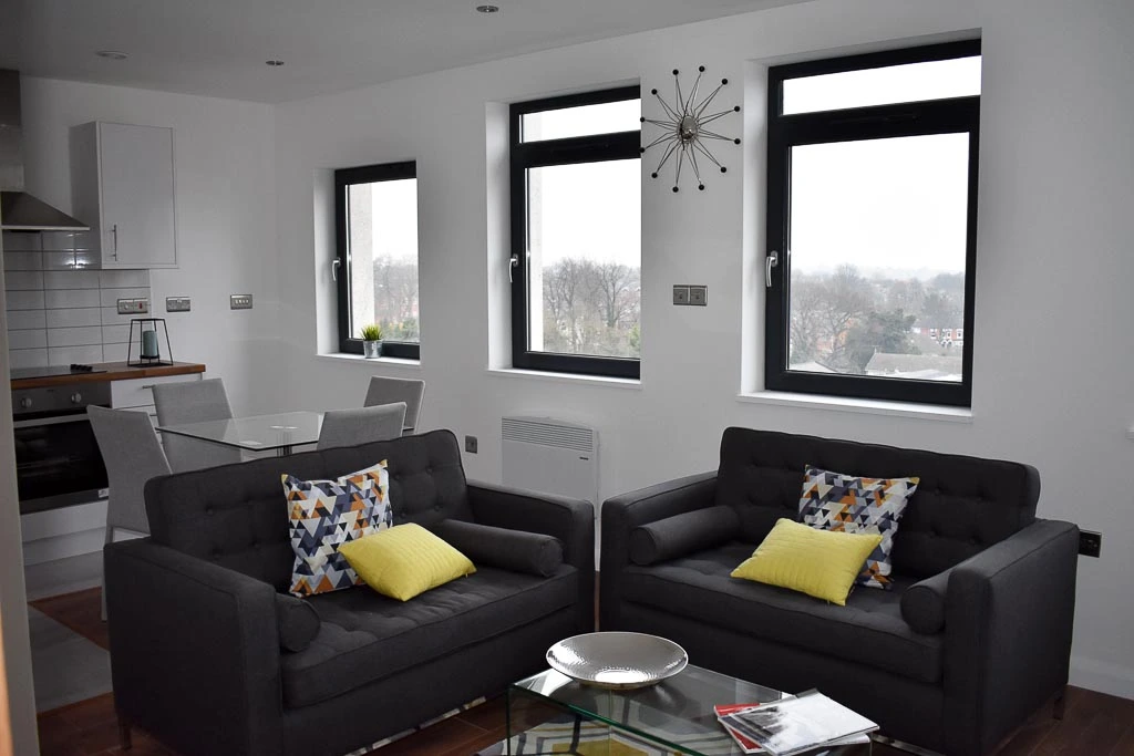 View of living room area with two couches.